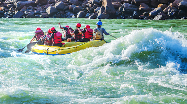 Tourists enjoying white water rafting in Kullu