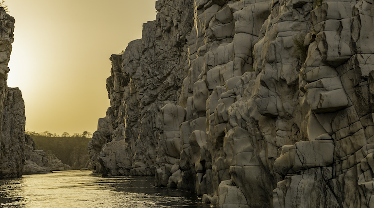 low angle shot of marble rocks of bhedaghat and river narmada